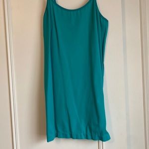 A longer length green camisole.